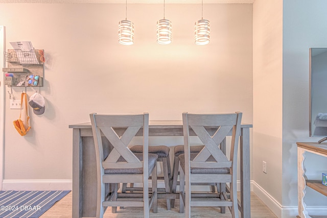 1401 S Palmetto Ave Unit 318, Daytona Beach, FL 32114 - dining room with wood finished floors and baseboards