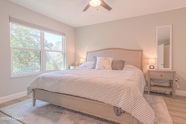 1401 S Palmetto Ave Unit 318, Daytona Beach, FL 32114 - bedroom with baseboards, light wood-style flooring, and ceiling fan