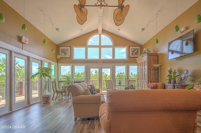 living room with french doors, beam ceiling, dark hardwood / wood-style flooring, high vaulted ceiling, and ceiling fan