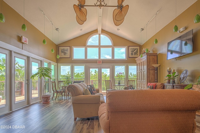 1401 S Palmetto Ave Unit 318, Daytona Beach, FL 32114 - living room with wood finished floors, track lighting, and high vaulted ceiling