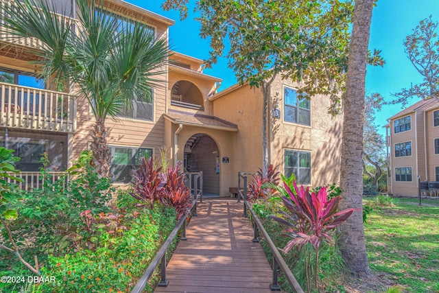 1401 S Palmetto Ave Unit 318, Daytona Beach, FL 32114 - view of front of home with stucco siding