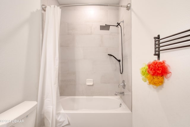 bathroom with shower / bath combo and toilet