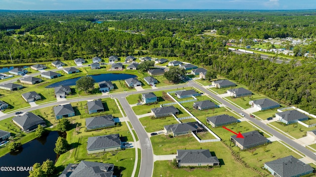 aerial view with a water view, a residential view, and a wooded view