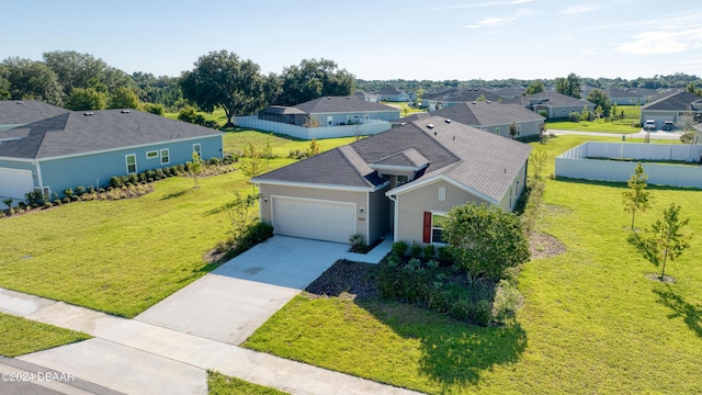 birds eye view of property with a residential view