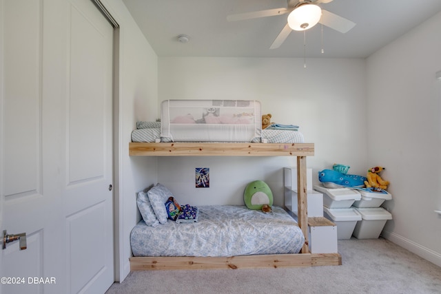 bedroom featuring ceiling fan, baseboards, and light colored carpet