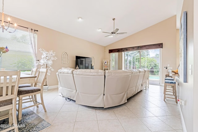 1405 Florida Moss Ln, Port Orange, FL 32128 - living room featuring vaulted ceiling, ceiling fan, light tile patterned floors, and a chandelier