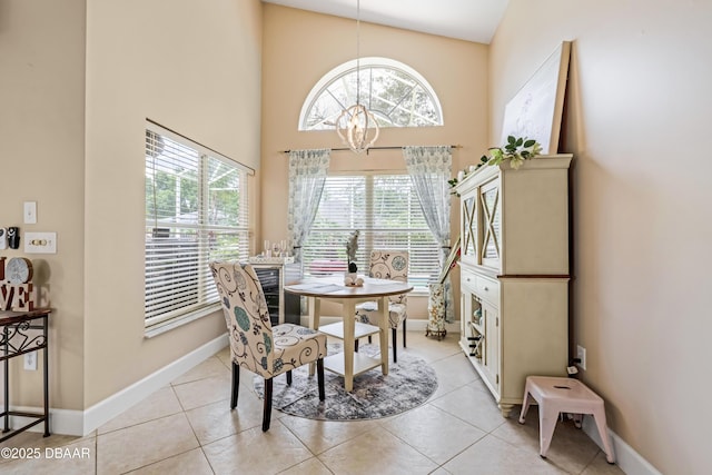 1405 Florida Moss Ln, Port Orange, FL 32128 - dining area featuring a chandelier, a high ceiling, and light tile patterned floors