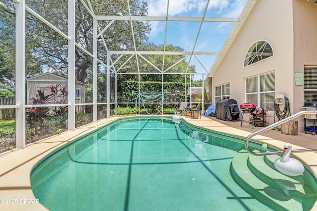 1405 Florida Moss Ln, Port Orange, FL 32128 - swimming pool featuring a patio area, glass enclosure, an outbuilding, and grilling area