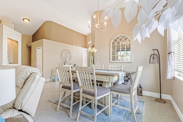 1405 Florida Moss Ln, Port Orange, FL 32128 - dining room featuring light tile patterned flooring, a chandelier, and a high ceiling