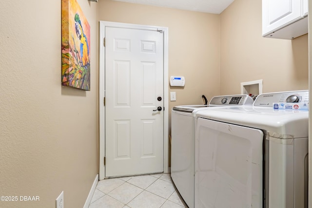 1405 Florida Moss Ln, Port Orange, FL 32128 - washroom featuring independent washer and dryer, cabinet space, and light tile patterned floors