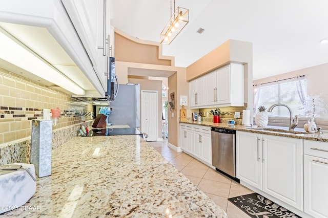 1405 Florida Moss Ln, Port Orange, FL 32128 - kitchen featuring stainless steel appliances, backsplash, light tile patterned flooring, and white cabinets