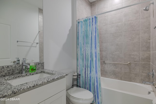 full bathroom featuring shower / bath combo, vanity, and toilet