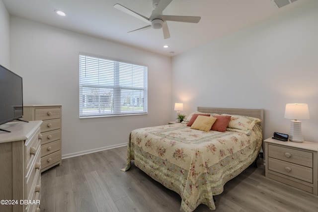 bedroom featuring light hardwood / wood-style flooring and ceiling fan