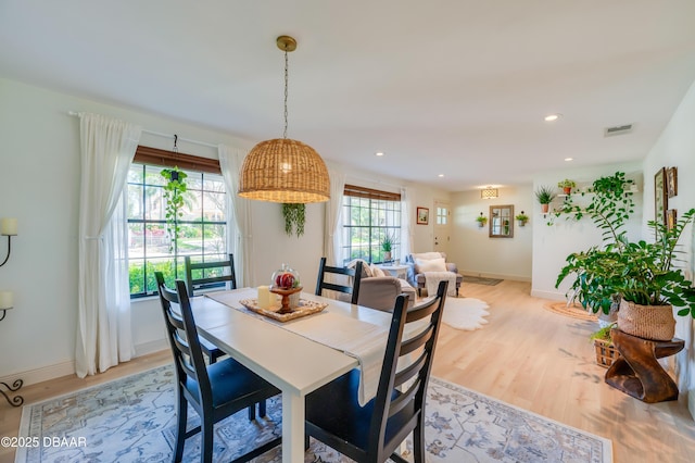 dining area with visible vents, recessed lighting, light wood-type flooring, and baseboards