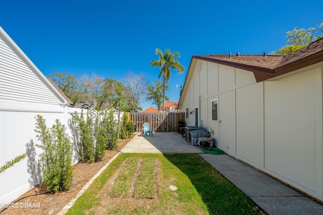 view of yard with a fenced backyard and a patio area