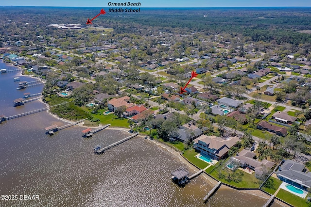 bird's eye view featuring a water view and a residential view