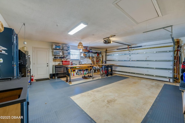 garage featuring a workshop area and a garage door opener