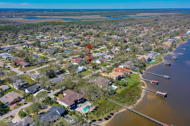birds eye view of property with a residential view and a water view