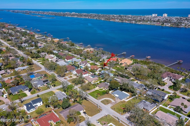 bird's eye view featuring a residential view and a water view
