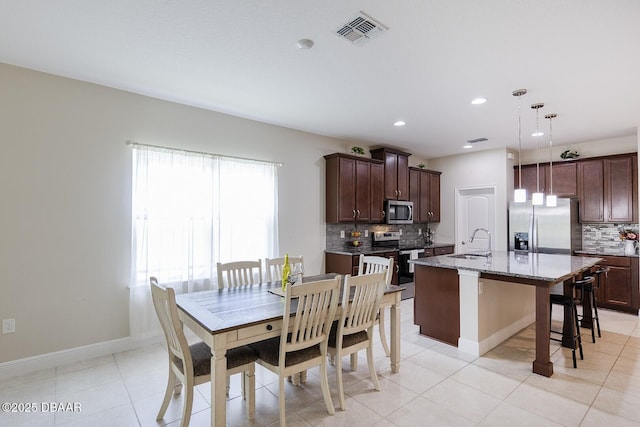 5567 Estero Loop, Port Orange, FL 32128 - dining room with recessed lighting, baseboards, visible vents, and light tile patterned floors