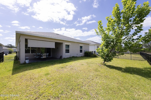 5567 Estero Loop, Port Orange, FL 32128 - back of property with a lawn, a patio, a fenced backyard, and stucco siding