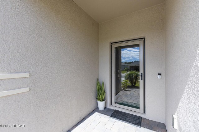 5567 Estero Loop, Port Orange, FL 32128 - view of exterior entry with stucco siding