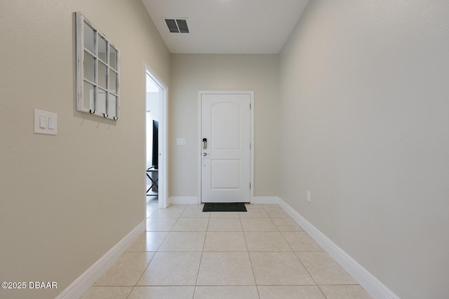 5567 Estero Loop, Port Orange, FL 32128 - doorway featuring visible vents, baseboards, and light tile patterned floors