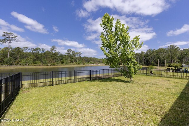 5567 Estero Loop, Port Orange, FL 32128 - view of yard featuring a fenced backyard and a water view