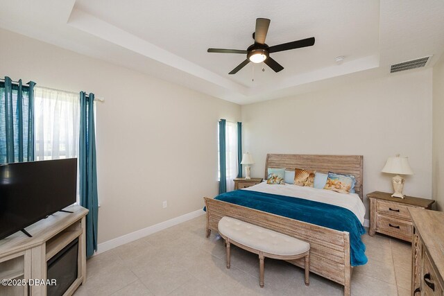 5567 Estero Loop, Port Orange, FL 32128 - bedroom with baseboards, visible vents, light tile patterned floors, and a raised ceiling