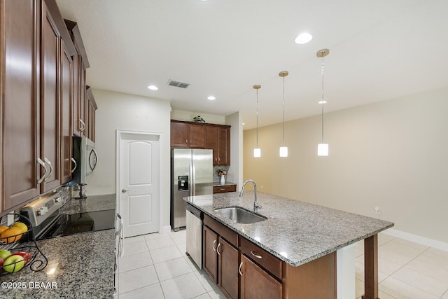 5567 Estero Loop, Port Orange, FL 32128 - kitchen featuring visible vents, appliances with stainless steel finishes, hanging light fixtures, a sink, and stone countertops