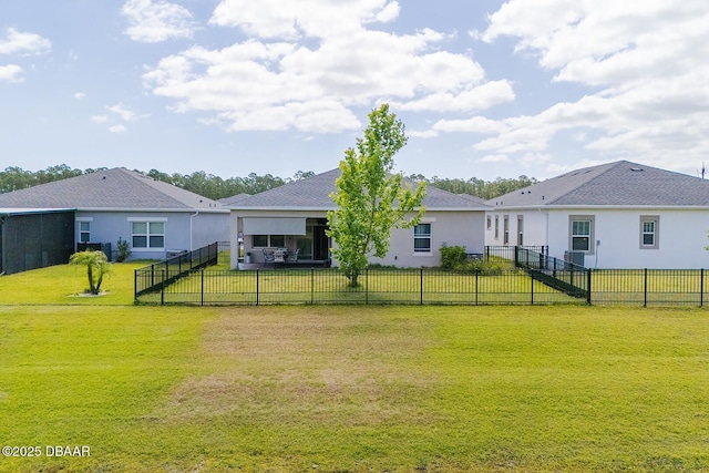 5567 Estero Loop, Port Orange, FL 32128 - rear view of property featuring a lawn, a fenced backyard, and stucco siding