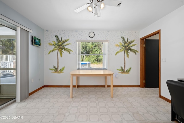 interior space with ceiling fan