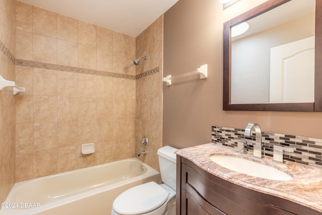 full bathroom featuring tiled shower / bath combo, toilet, backsplash, and vanity