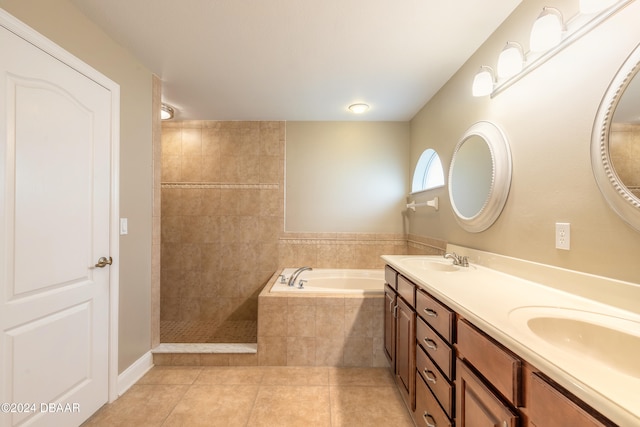 bathroom with tile patterned flooring, vanity, and separate shower and tub