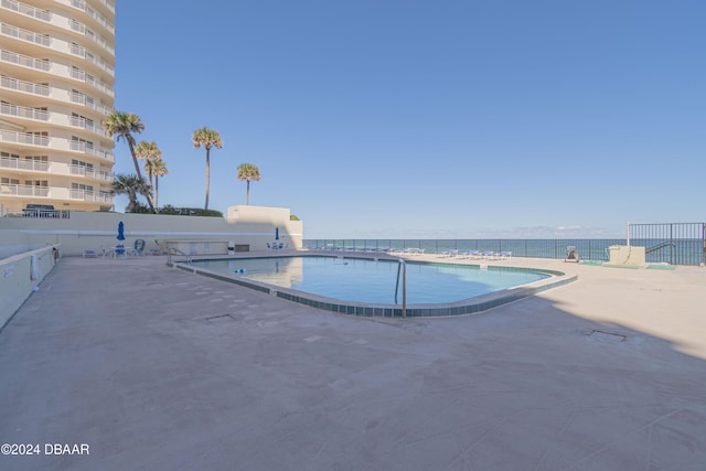 view of swimming pool featuring a patio