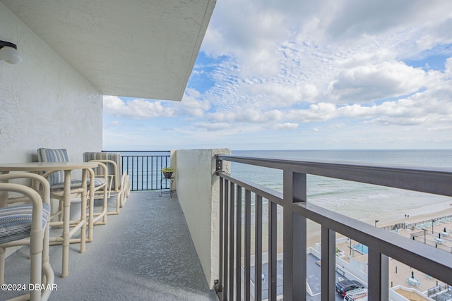 balcony featuring a water view