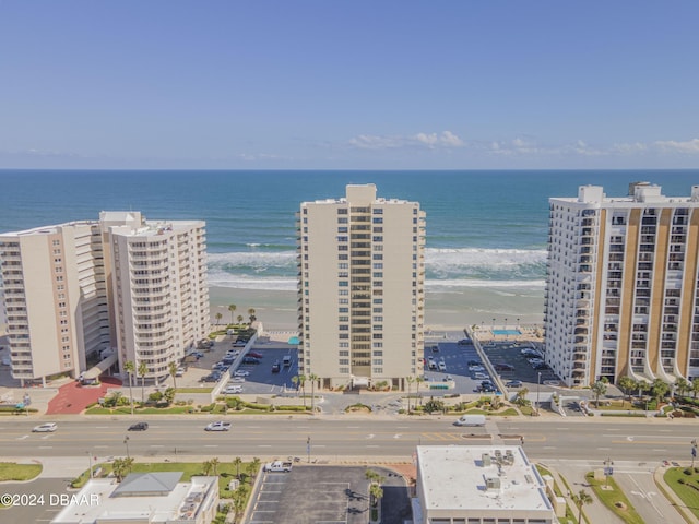 aerial view featuring a water view and a view of the beach