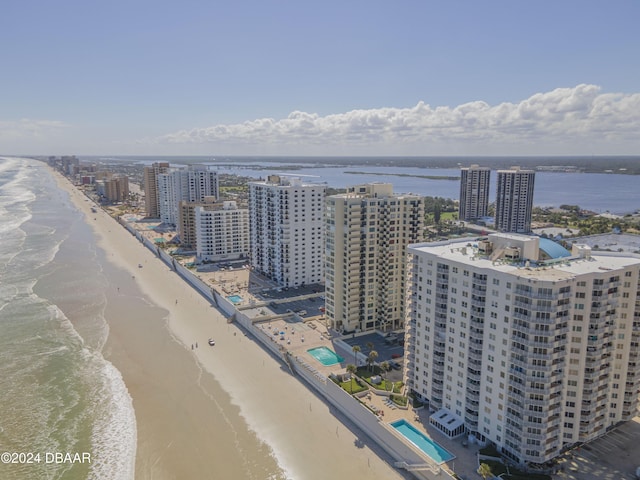 birds eye view of property featuring a view of the beach and a water view