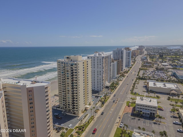 bird's eye view featuring a view of the beach and a water view