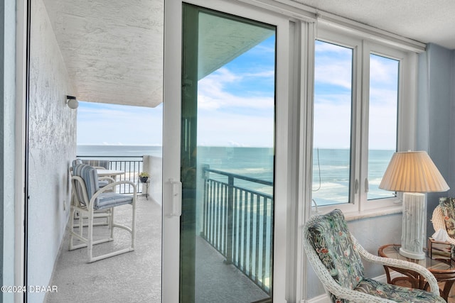 balcony featuring a water view