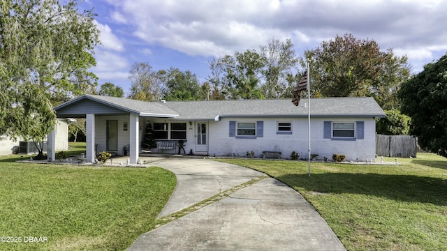 single story home featuring a porch, a front lawn, and central air condition unit