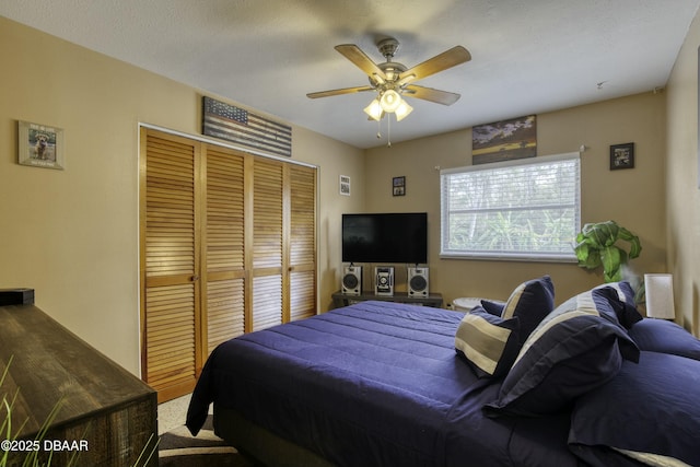 bedroom featuring a closet and ceiling fan