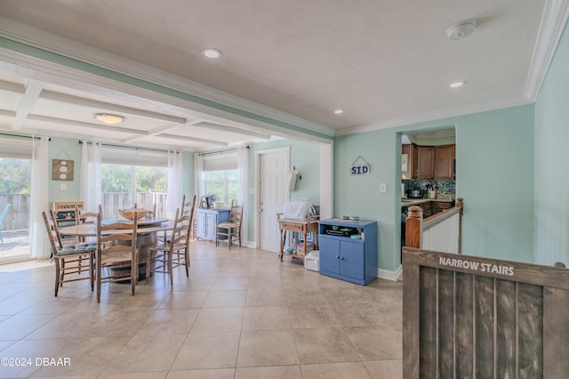 dining space featuring a wealth of natural light, light tile patterned floors, and ornamental molding