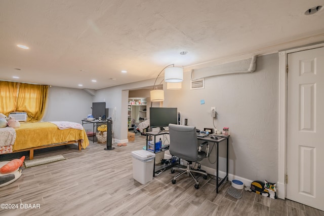 bedroom featuring hardwood / wood-style floors