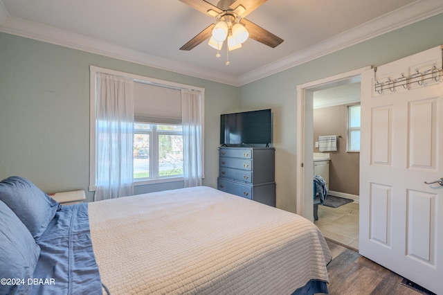 bedroom with ornamental molding, wood-type flooring, and ceiling fan