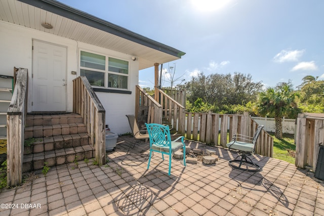 view of patio / terrace featuring an outdoor fire pit