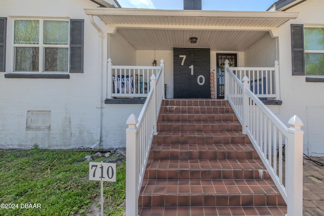 entrance to property with covered porch