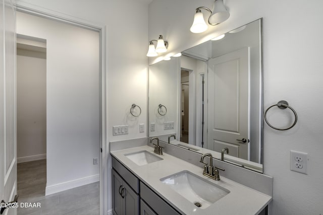 1316 Loftwedge Cir, Daytona Beach, FL 32124 - bathroom featuring double vanity and baseboards