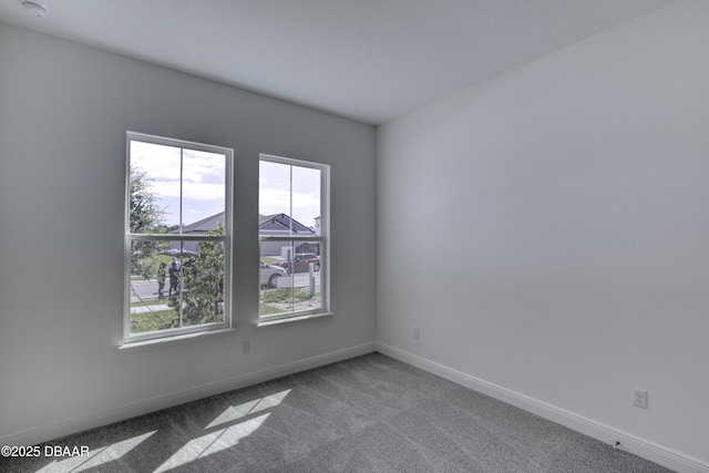1316 Loftwedge Cir, Daytona Beach, FL 32124 - spare room featuring plenty of natural light, carpet, and a smoke detector