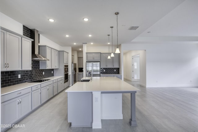 1316 Loftwedge Cir, Daytona Beach, FL 32124 - kitchen featuring gray cabinetry, appliances with stainless steel finishes, wall chimney exhaust hood, backsplash, and recessed lighting